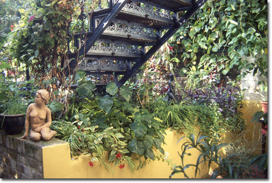 Detail of the garden at 286 with terracotta and bronze sculptures.